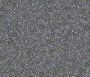 a close up of a gray surface with a lot of small balls on it