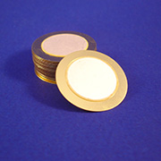 a stack of gold coins on a blue surface