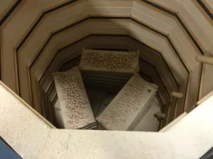 a large ceramic kiln filled with ceramic tiles .