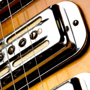 a close up of the pickups on an electric guitar