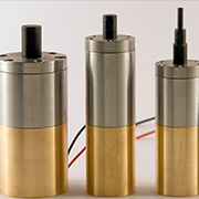 three metal cylinders with wires attached to them